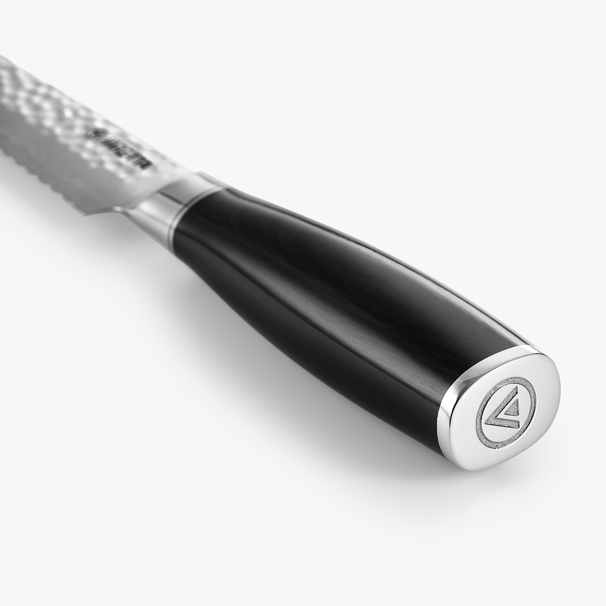 Endekappe i metal med logo på Shōjin Taru brødkniv