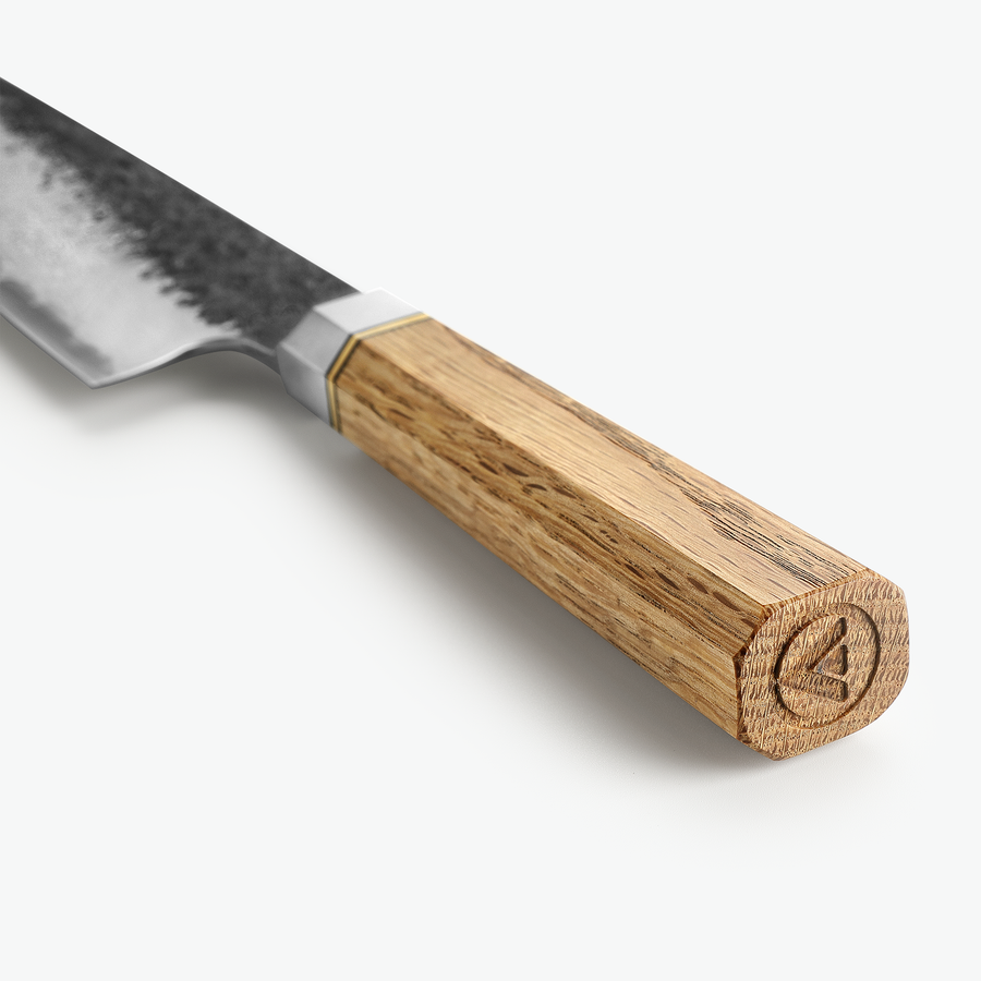 Ottekantet grebsende i eg med logo på Shōjin Kashi kokkekniv