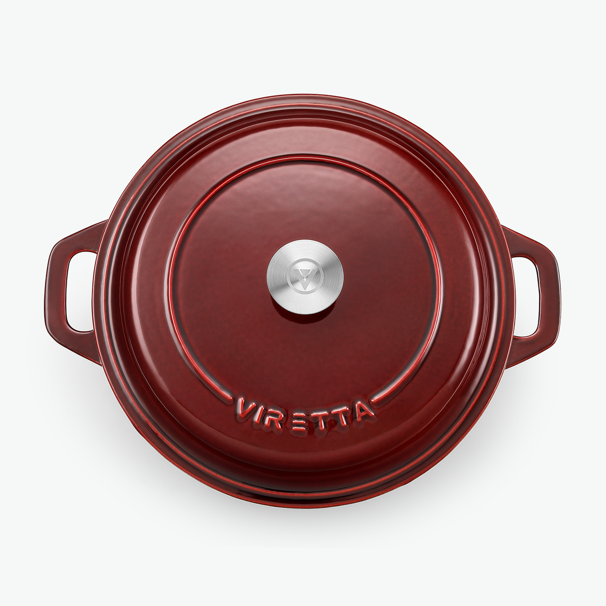 Låget på støbejernsgryden i ribsrød med knop i rustfrit stål og præget logo, set ovenfra
